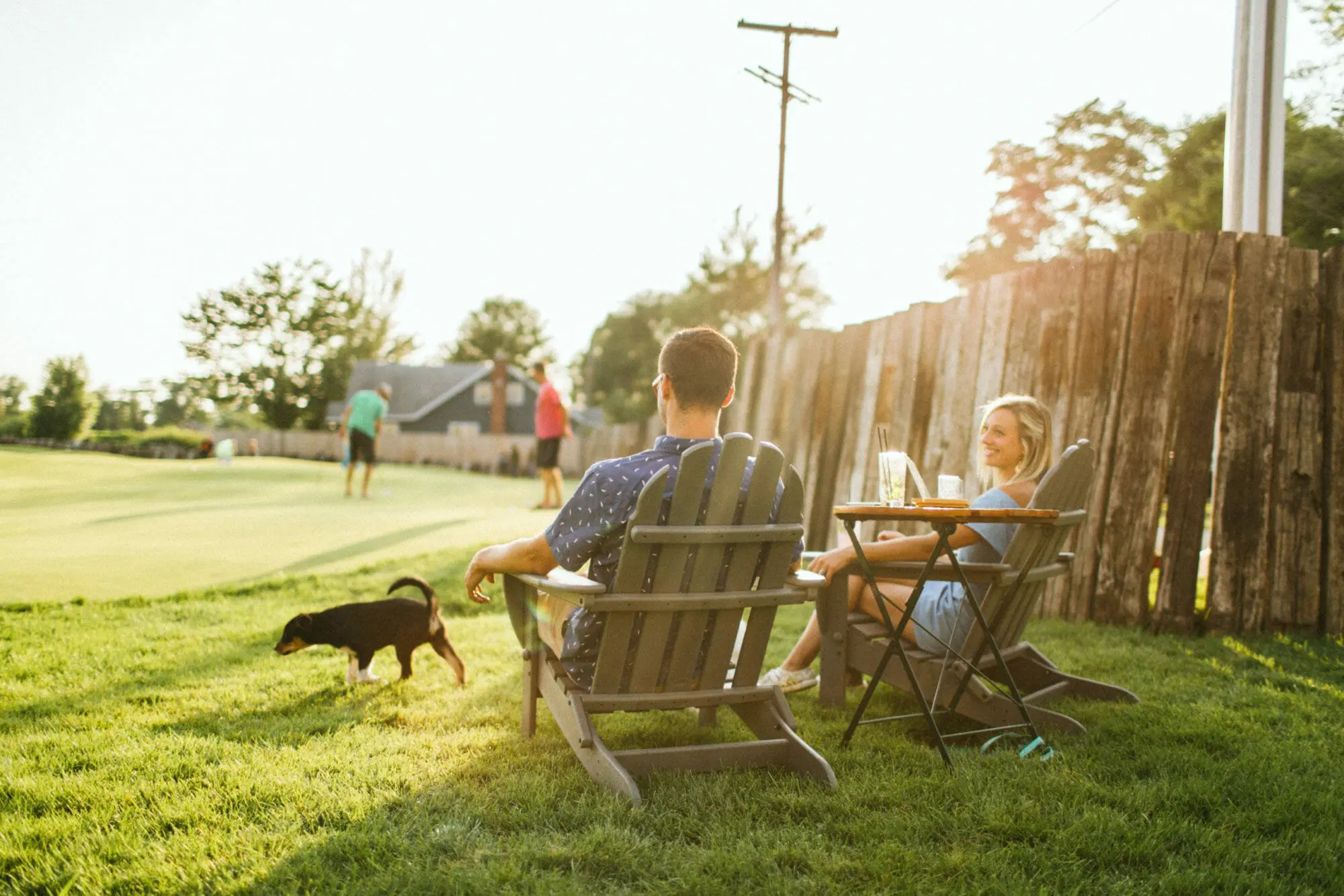 Man and Woman Sitting at Distillery